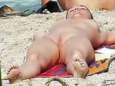 Hot and horny nudists having fun at beach spied by voyeurr